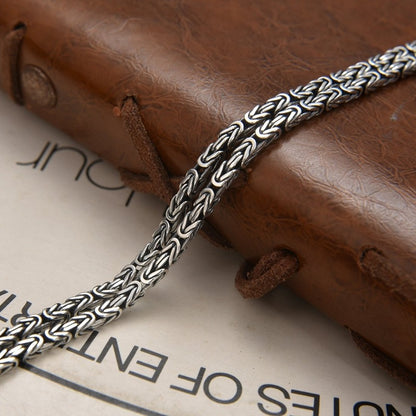 Double row braided peace pattern bracelet